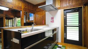 A kitchen or kitchenette at Mannaya -SEVEN Hotels and Resorts-