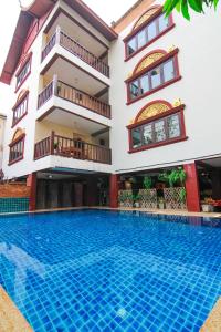 a large swimming pool in a large building at S.K.House 2 in Chiang Mai