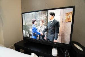 a flat screen tv sitting on a table at Hill Side Terrace Hiroo Shibuya 202 in Tokyo