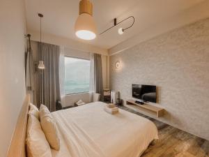 Ένα ή περισσότερα κρεβάτια σε δωμάτιο στο Two Easy Inn