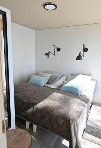 Łóżko lub łóżka w pokoju w obiekcie TOP Star Lakeland Viitasaari