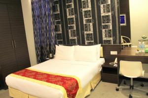 Voodi või voodid majutusasutuse Springz Hotel-Bukit Jalil toas