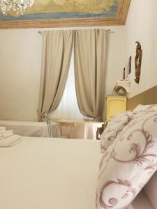Postel nebo postele na pokoji v ubytování Il Sogno Torino Guesthouse