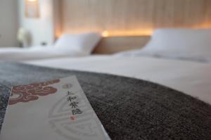 Una cama o camas en una habitación de 武当山太和紫隐酒店