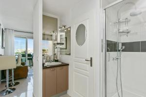 a bathroom with a shower and a sink at L'After Port Nature in Cap d'Agde