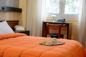 Posteľ alebo postele v izbe v ubytovaní Victory Inn Hotel