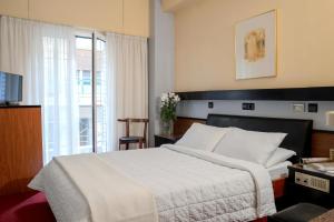 Posteľ alebo postele v izbe v ubytovaní Victory Inn Hotel