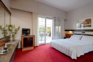 Posteľ alebo postele v izbe v ubytovaní Victory Inn Hotel