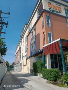 a building on the side of a street at The One Residence in Udon Thani