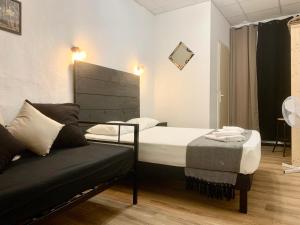 Postel nebo postele na pokoji v ubytování Hotel Le Centre