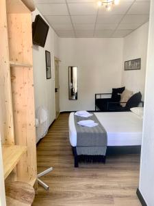 Postel nebo postele na pokoji v ubytování Hotel Le Centre