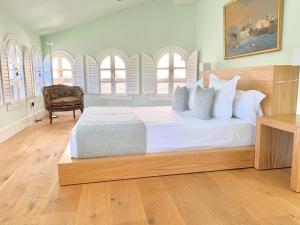 Postel nebo postele na pokoji v ubytování Hotel Boutique Palacio Corredera