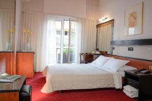 Posteľ alebo postele v izbe v ubytovaní Victory Inn Hotel