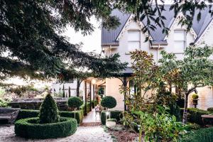 a house with a garden in front of it at The Stable Lofts in Carrick