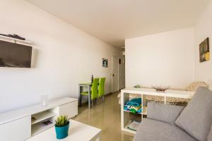 a living room with a couch and a table at Apartment Bonamar in Las Palmas de Gran Canaria