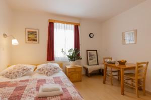 Postel nebo postele na pokoji v ubytování Apartments Rozle