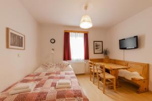 Postel nebo postele na pokoji v ubytování Apartments Rozle