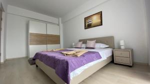Katil atau katil-katil dalam bilik di Mario Building Apartments