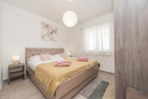 Postel nebo postele na pokoji v ubytování VILLA FAMILY SUKOŠAN, ZADAR