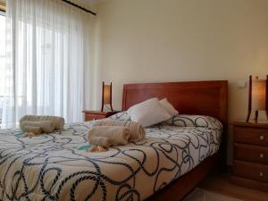 A bed or beds in a room at Alltravel Primavera Apartment