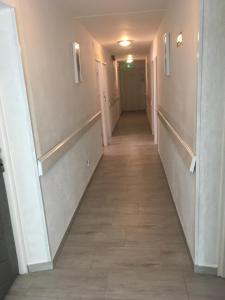 a hallway of a building with a long corridor at Beatka in Świeradów-Zdrój