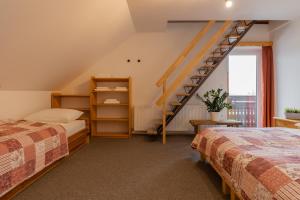 Postel nebo postele na pokoji v ubytování Apartments Rozle