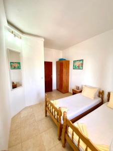 a bedroom with two beds in a room at Apartments Aga in Ulcinj