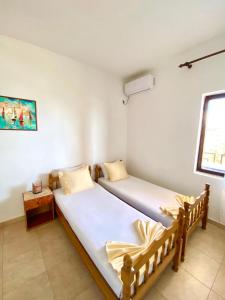 Postel nebo postele na pokoji v ubytování Apartments Aga