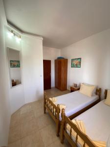 Postel nebo postele na pokoji v ubytování Apartments Aga
