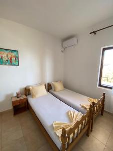 Postel nebo postele na pokoji v ubytování Apartments Aga