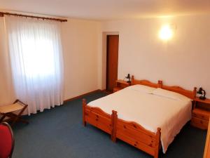 Postel nebo postele na pokoji v ubytování Albergo Trieste