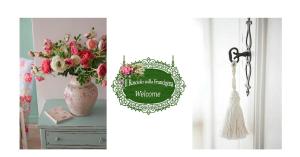 wazon kwiatów na stole obok okna w obiekcie Il Rosciolo Sulla Francigena w mieście Formello