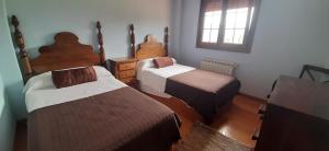 En eller flere senge i et værelse på Villa Ibio