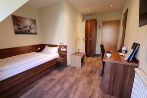Postel nebo postele na pokoji v ubytování Hotel Klosterbräustuben