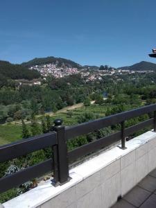 a view of a city from a balcony at Moradia Lili in Ronqueira
