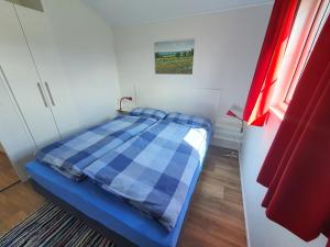 Ένα ή περισσότερα κρεβάτια σε δωμάτιο στο Ostermade Klintdoerp 110