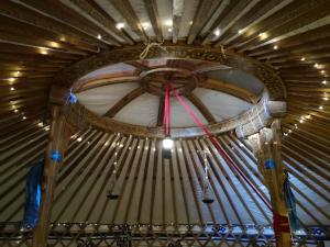 a close up of a wooden ceiling with strings at Yourte Mont-Saint-Michel in Jullouville-les-Pins