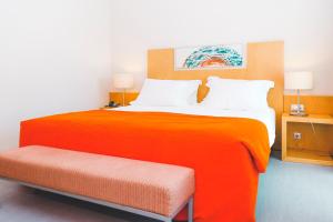 Кровать или кровати в номере Hotel Praia