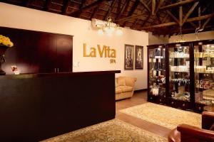 a wine store with a la vita sign on the wall at First Group Magalies Park in Hartbeespoort