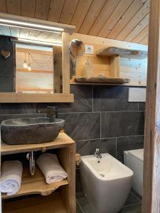 a bathroom with a sink and a toilet at Stura River Village RAFTING in Gaiola