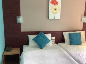 Cama o camas de una habitación en OYO 996 Phunara Residence