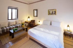 Ένα ή περισσότερα κρεβάτια σε δωμάτιο στο Ecolodge Quaryati Marrakech