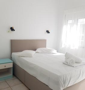 A bed or beds in a room at Marina Villa