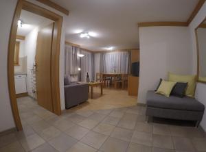 Posezení v ubytování Apartment Swiss Chalet