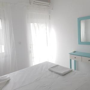 A bed or beds in a room at Marina Villa