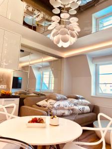 a living room with a couch and a table at Dream Apartments Sopot in Sopot