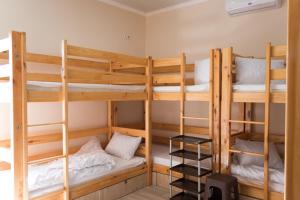 a room with three bunk beds in it at Хостел на Баварии in Kharkiv