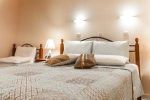 A bed or beds in a room at Hotel Electra