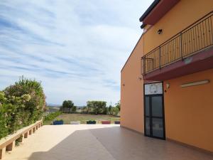 a view of a building with a balcony at Light Blue Room in Scordia