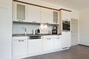 Η κουζίνα ή μικρή κουζίνα στο Moderne City Appartments im Stadtzentrum +38 φωτογραφίες